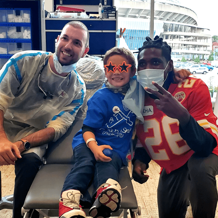 Image of kids from the free dental checkup at Arrowhead Stadium